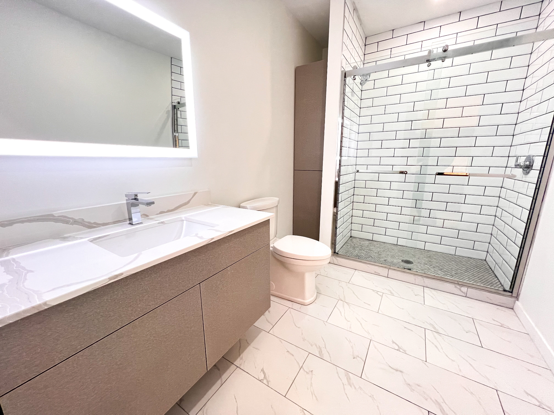 Modern bathroom with subway tile shower