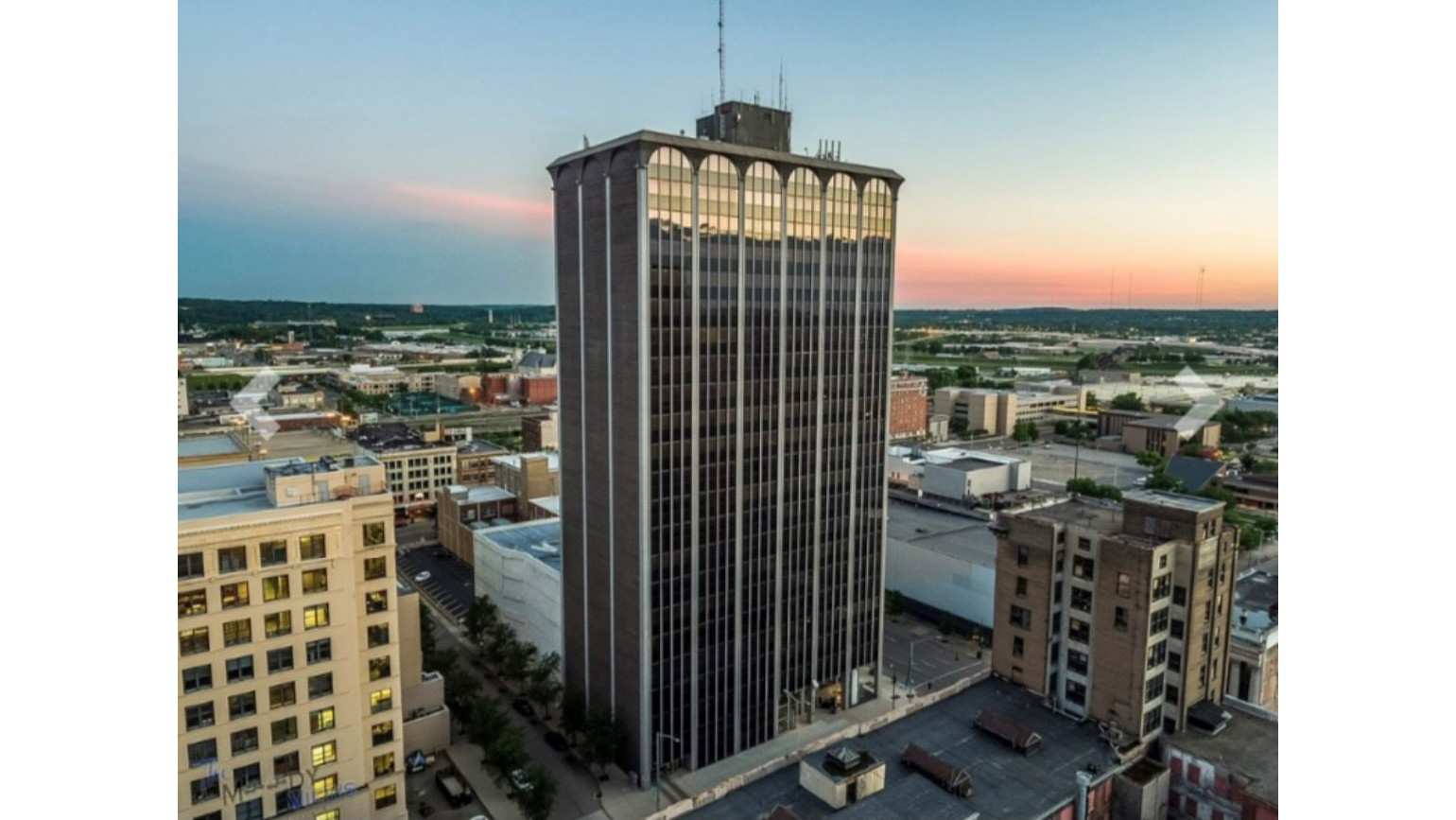 The Deneau building at sunset